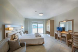 A bed or beds in a room at Sea View Resorts & Spa