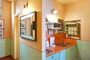 A kitchen or kitchenette at Poggio Imperiale Apartments