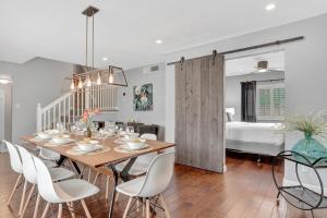 a dining room with a table and chairs and a bed at 49th St in Phoenix