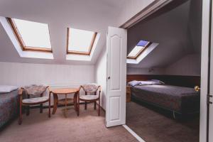 Postel nebo postele na pokoji v ubytování Hotel Twins