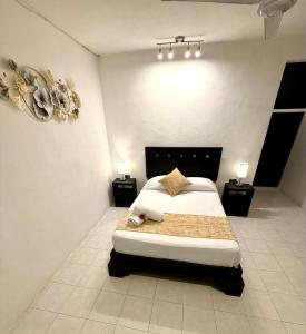 Ein Bett oder Betten in einem Zimmer der Unterkunft Hotel Baroni