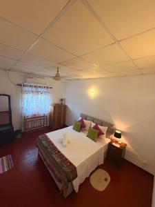 a bedroom with a large bed in a room at Serenity stay Mirissa in Mirissa
