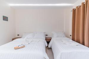 Ένα ή περισσότερα κρεβάτια σε δωμάτιο στο Orchrd Lodge