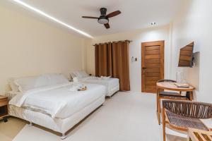 Ένα ή περισσότερα κρεβάτια σε δωμάτιο στο Orchrd Lodge
