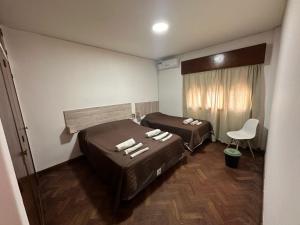 Postel nebo postele na pokoji v ubytování Hostel Vicente