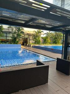 a large swimming pool inside of a building at Republic Plaza Airpot Tân Sơn Nhất view sân bay in Ho Chi Minh City