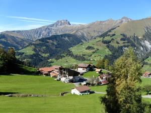 a small village in a valley with mountains at Chalet Weidli in Achseten
