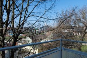 a view of the city from a balcony at Zenit Apartman in Makó