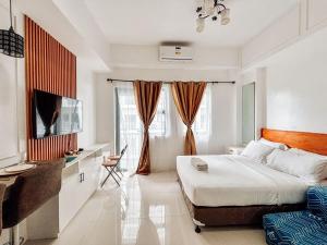 Μια τηλεόραση ή/και κέντρο ψυχαγωγίας στο A Minimalist Urban Retreat
