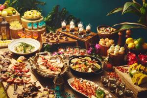 a buffet with many different types of food on a table at ANA InterContinental Manza Beach Resort by IHG in Onna