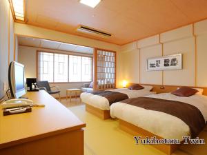 Cama ou camas em um quarto em Hotel Taisetsu Onsen&Canyon Resort