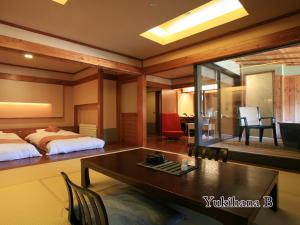Cama ou camas em um quarto em Hotel Taisetsu Onsen&Canyon Resort
