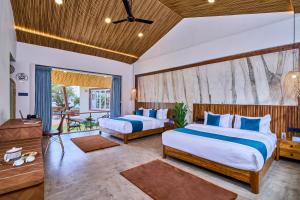 a bedroom with two beds and a balcony at SaffronStays Eagle's Span in Malavli