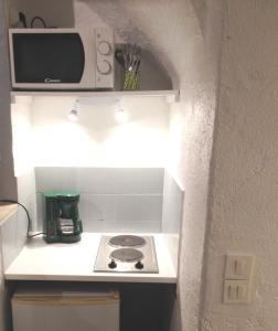 Kuchyň nebo kuchyňský kout v ubytování Appartement L'Atypique