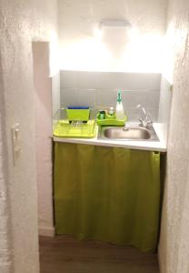 Kuchyň nebo kuchyňský kout v ubytování Appartement L'Atypique