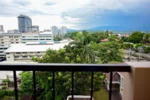 a view of a city from a balcony at Cozy Davao Studio with Queen and Bunk Bed Near Abreeza Mall in Davao City