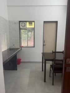 Kuchyň nebo kuchyňský kout v ubytování Cozy 1BHK Apartment - Casa Asud