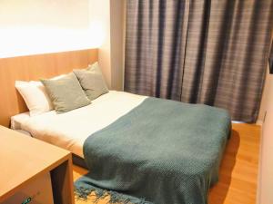 Postel nebo postele na pokoji v ubytování R Hotel Namba