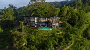 an aerial view of a house in the forest at Walaa Kulu by Vella in Ella