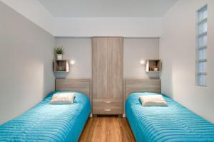 Posteľ alebo postele v izbe v ubytovaní Apartment Masarska