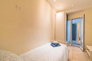 Ένα ή περισσότερα κρεβάτια σε δωμάτιο στο Stupendo Trilocale [Posto Auto Gratuito - WiFi & Netflix]