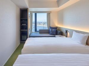 Dorsett by Agora Osaka Sakai客房内的一张或多张床位