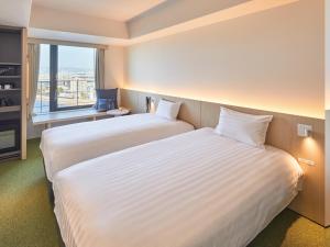 Dorsett by Agora Osaka Sakai客房内的一张或多张床位