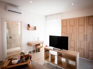 TV a/nebo společenská místnost v ubytování Da Filippo B&B