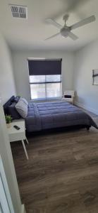 a bedroom with a large bed and a window at The Shack in Walker Flat +20 photos