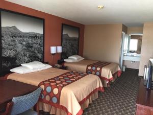 Voodi või voodid majutusasutuse Super 8 by Wyndham Bastrop TX toas