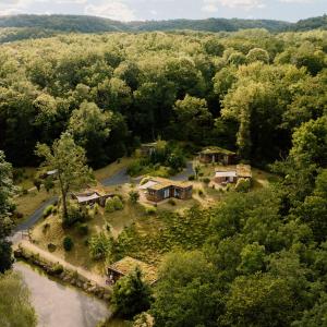 an aerial view of a house in the middle of a river at Volvic Organic Resort in Volvic