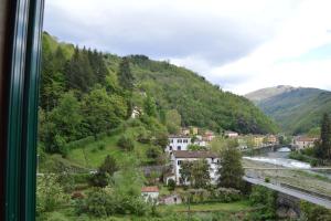 a view from a train window of a town and a river at Bellavista apartment in Bagni di Lucca
