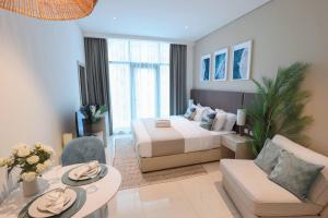 Кровать или кровати в номере Fantastic Studio Apartment at Palm Jumeirah