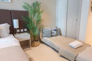 Кровать или кровати в номере Fantastic Studio Apartment at Palm Jumeirah