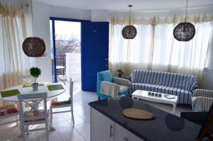 a living room with a couch and a table at Mia's Cove in Paphos
