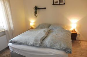 a bed with two pillows on it in a bedroom at Ferienhaus Marienhafe in Marienhafe