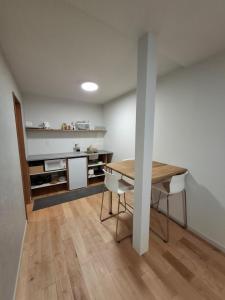 Kuchyň nebo kuchyňský kout v ubytování Phoenix Suites Myoko #101