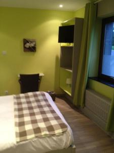 Voodi või voodid majutusasutuse Hotel Val De La Cascade toas