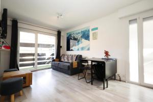 a living room with a couch and a table at Résidence Les Esserts - Les Esserts MAE-3931 in Les Houches