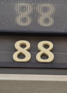 a sign on a building with the number at Armação Beach Residences in Armação de Pêra