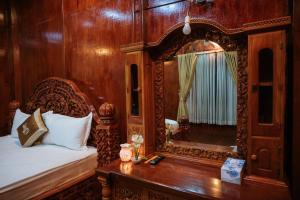 Postel nebo postele na pokoji v ubytování Srey Krob Leak Resort , ស្រីគ្រប់លក្ខណ៌ រីសត