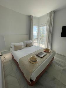 Postel nebo postele na pokoji v ubytování Hotel Aromar