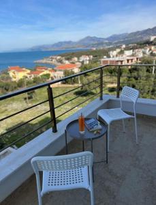 two chairs and a table on a balcony with a view at Apartment Complex with Pool in Bar, Montenegro in Bar