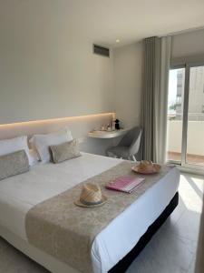 Postel nebo postele na pokoji v ubytování Hotel Aromar