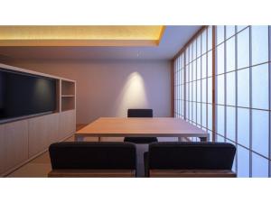 a conference room with a table and chairs and a tv at SOKI ATAMI - Vacation STAY 93423v in Atami