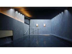 a swimming pool with two lights on the wall at SOKI ATAMI - Vacation STAY 93423v in Atami