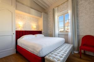 Posteľ alebo postele v izbe v ubytovaní San Firenze Suites & Spa