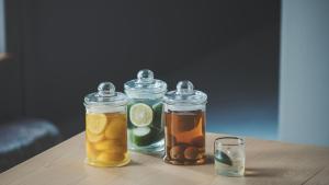 a group of three jars of honey and lemons on a table at SOKI ATAMI - Vacation STAY 93420v in Atami