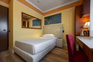Ένα ή περισσότερα κρεβάτια σε δωμάτιο στο iH Hotels Padova Admiral