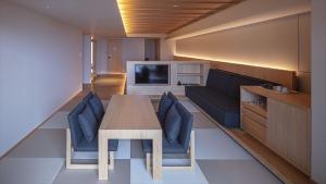 a living room with a table and a couch at SOKI ATAMI - Vacation STAY 01462v in Atami